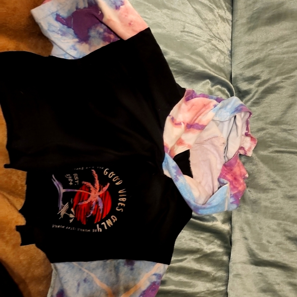A small cropped hooded t-shirt in color black with tie dye
